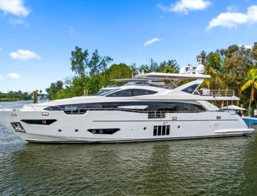 Spacious luxury yacht cruising through turquoise waters, offered by Ozgun Yachting