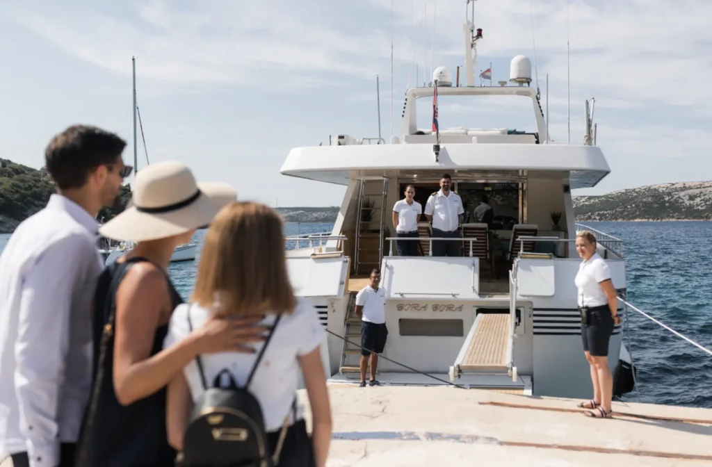 Spacious luxury yacht cruising through turquoise waters, offered by Ozgun Yachting