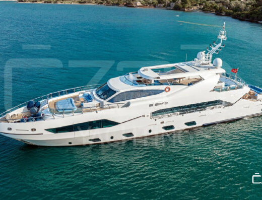 Destiny yacht anchored off the coast during a Bodrum yacht charter with stunning sea views