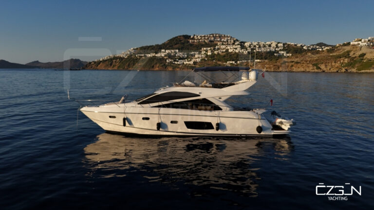 Couple enjoying sunset on a luxury yacht during a Bodrum yacht charter experience.