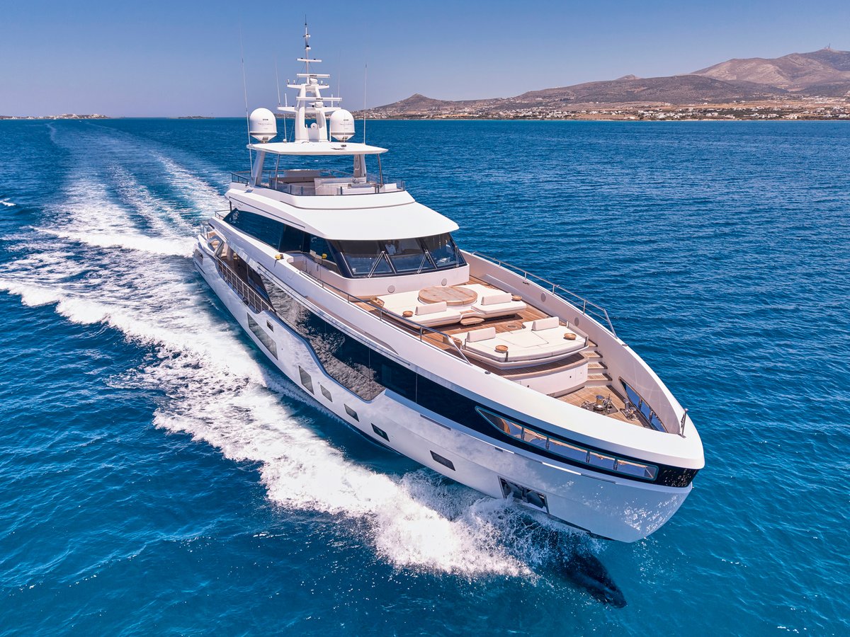 "Motor yacht Volo Mare cruising through the crystal-clear waters of the Greek islands"