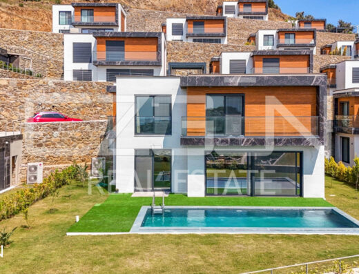 Deniz manzaralı modern villa, Yalıkavak Bodrum'da, özel bahçesi ve geniş terasıyla öne çıkan lüks yapı.